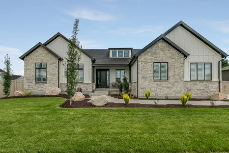 house with green healthy front lawn