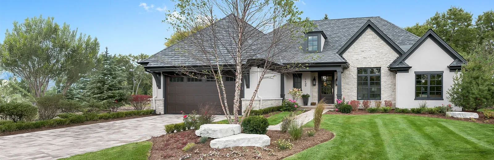 trees and shrubs, nicely maintained front yard